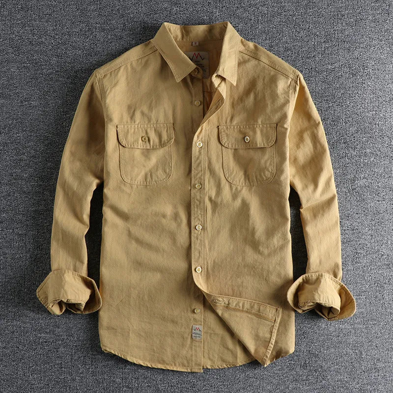 Men's solid colour cotton long sleeve shirt in British retro cardigan style, shown in light blue.