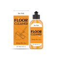 Floor cleaner 100ml bottle with lemon essence, standing on a tiled floor