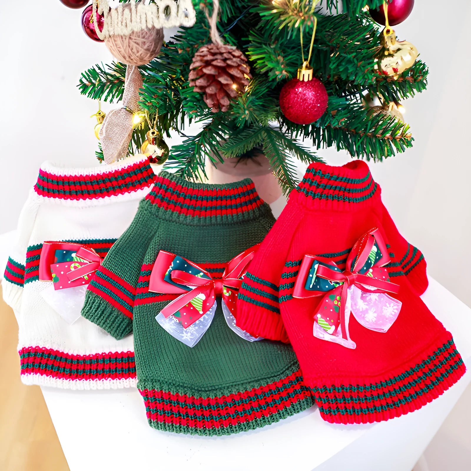 Red and green polyester dog Christmas jumper shown in sizes XS, S, M, L, and XL for dogs 1kg to 9kg.