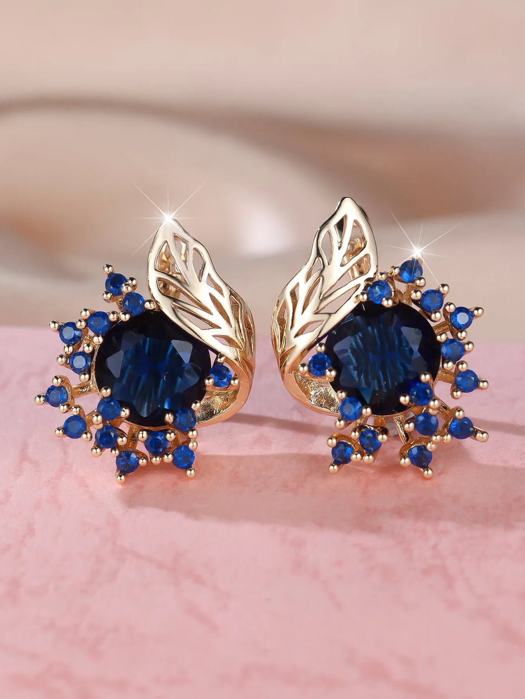 Round flower feather design earrings with champagne gold setting and coloured zircon stones.