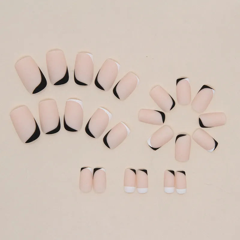 Black and white frosted false nails with Mandarin duck colour pattern and plastic protective armour