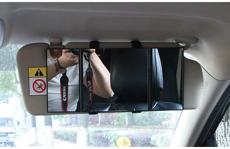 Silver car folding makeup mirror shown both closed and open positions