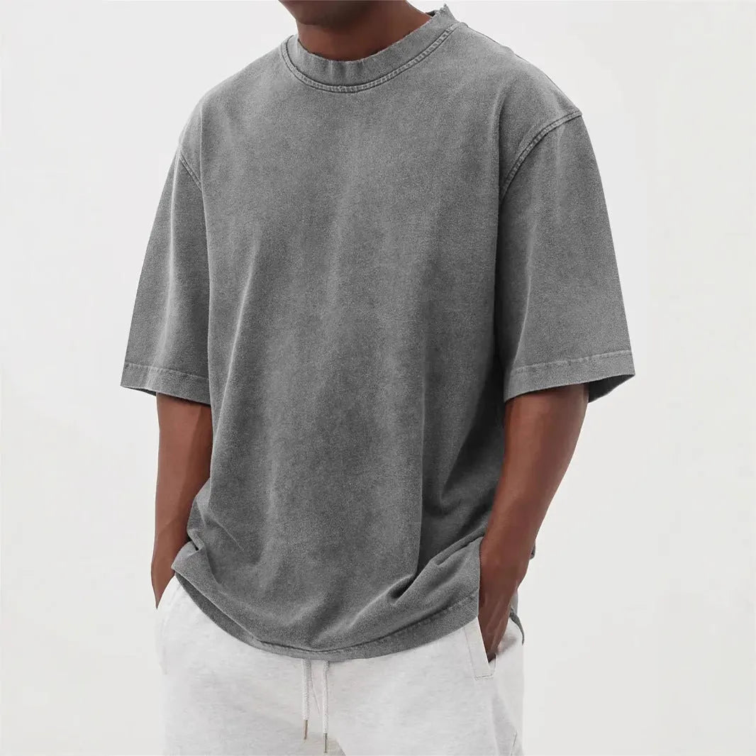 Men's stone washed distressed t-shirt in loose fit with half sleeves available in multiple colours