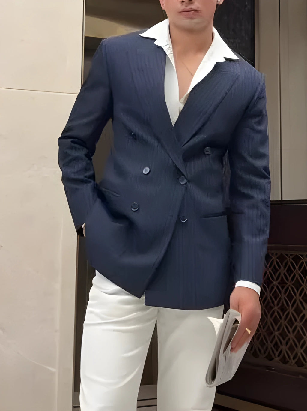 Men's classic striped double-breasted blazer on a hanger