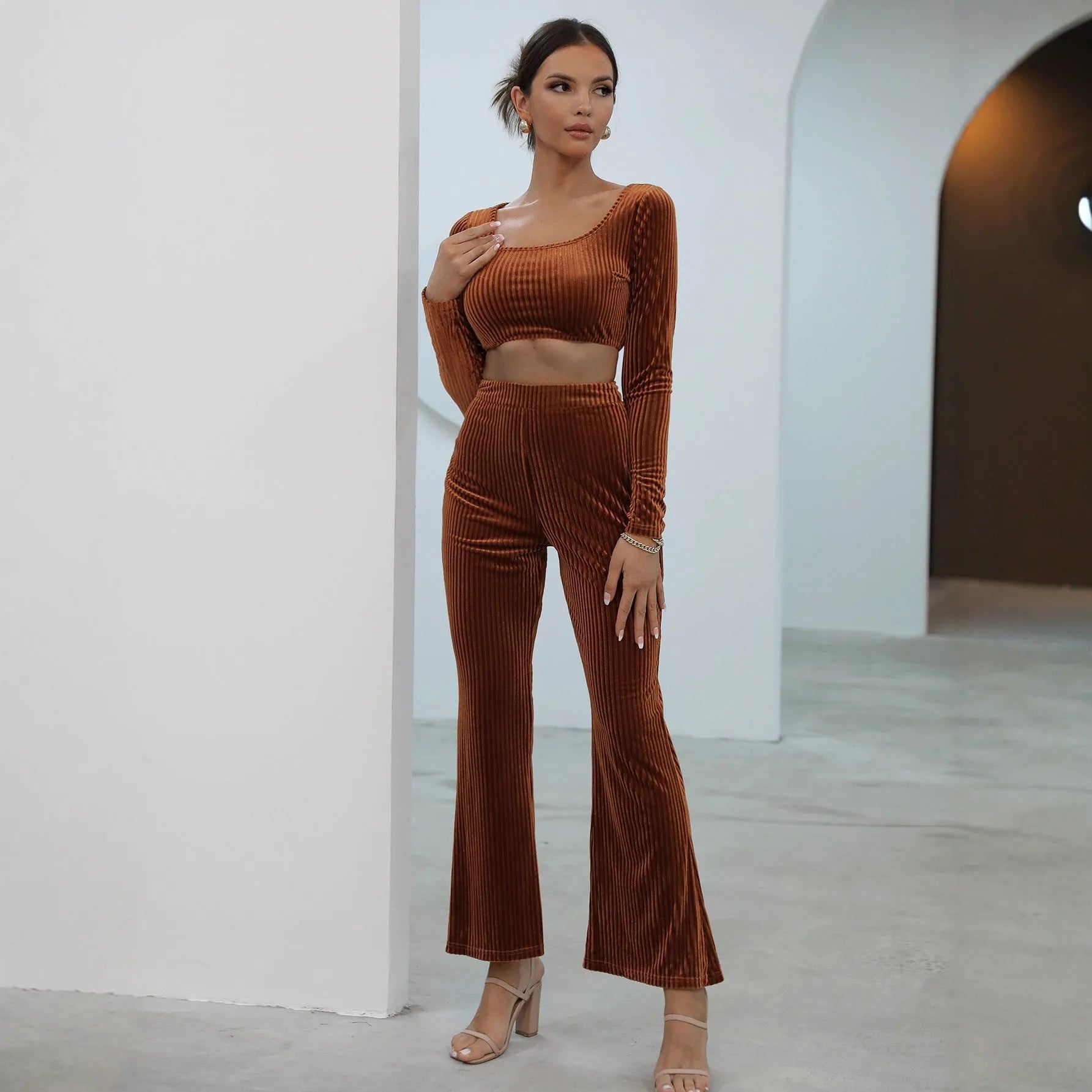 Caramel-coloured long sleeve sweater set with matching top and trousers on hanger