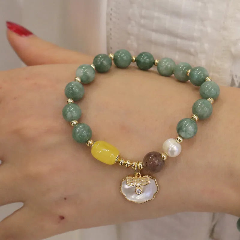 Natural green jade and shell bead bracelet with adjustable cord for women.