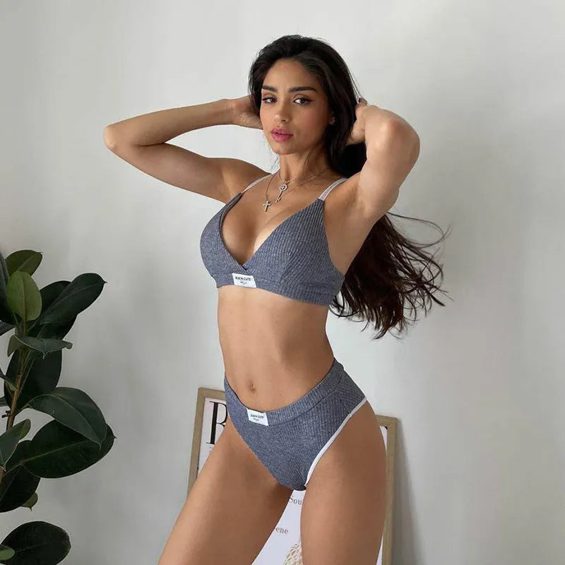 Women's bikini set with contrast binding and letter embroidery details, sleeveless design with shorts-length bottoms
