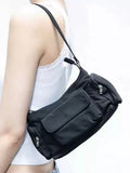 Black nylon shoulder bag with two pockets showing side line detail and 24cm dimensions