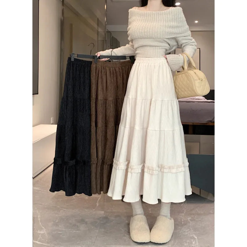 Korean style corduroy A-line midi skirt with elastic waistband in milky white, shown on a model.