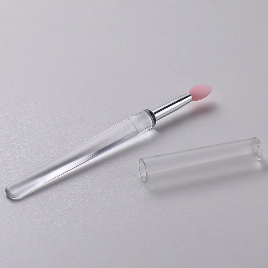 Set of silicone lip brushes with caps in various colours including blue, pink, purple and red.