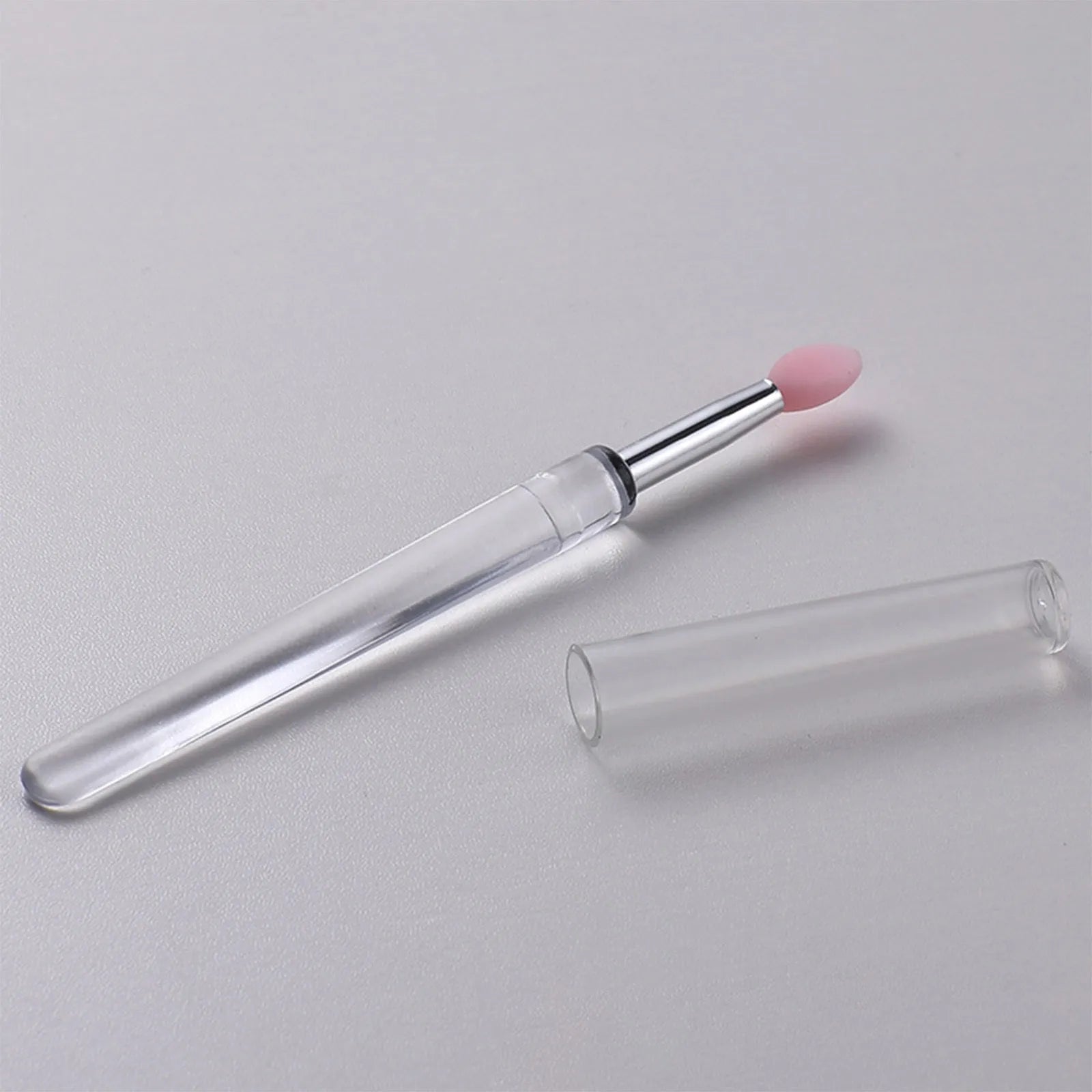 Set of silicone lip brushes with caps in various colours including blue, pink, purple and red.