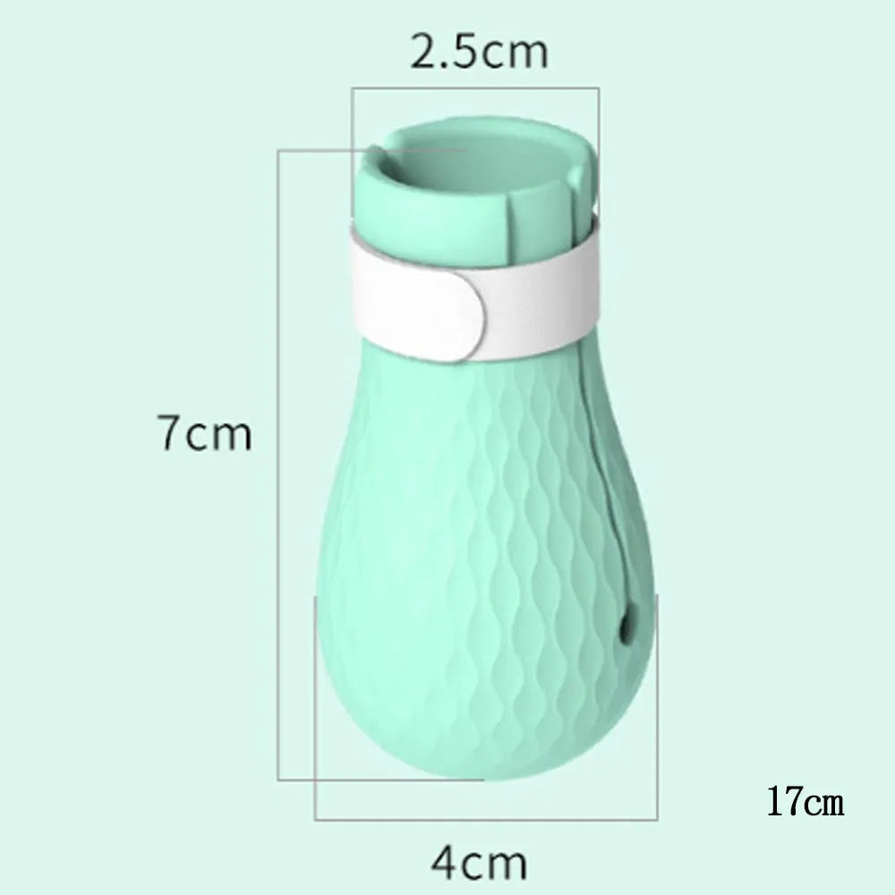 Four green silicone cat paw scratch protection covers for pet grooming.
