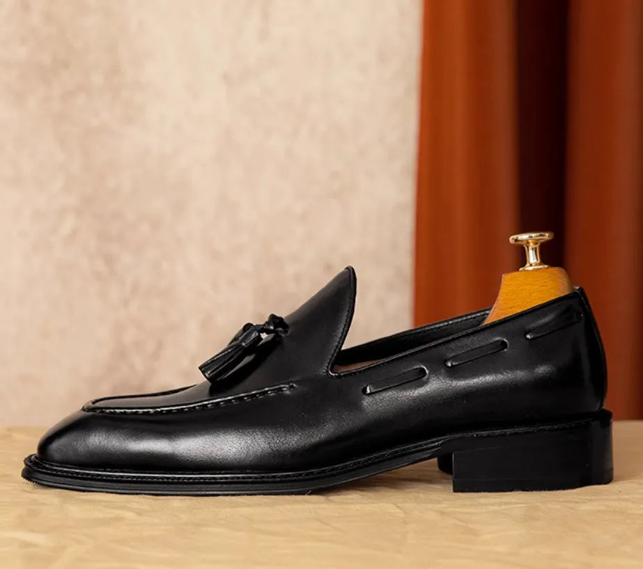 Men's genuine leather slip-on loafers in black and brown with fringed detailing and rubber soles
