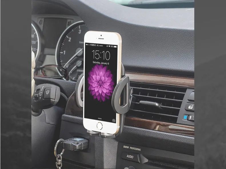 Black plastic car air conditioning vent mobile phone holder mounted on vehicle dashboard