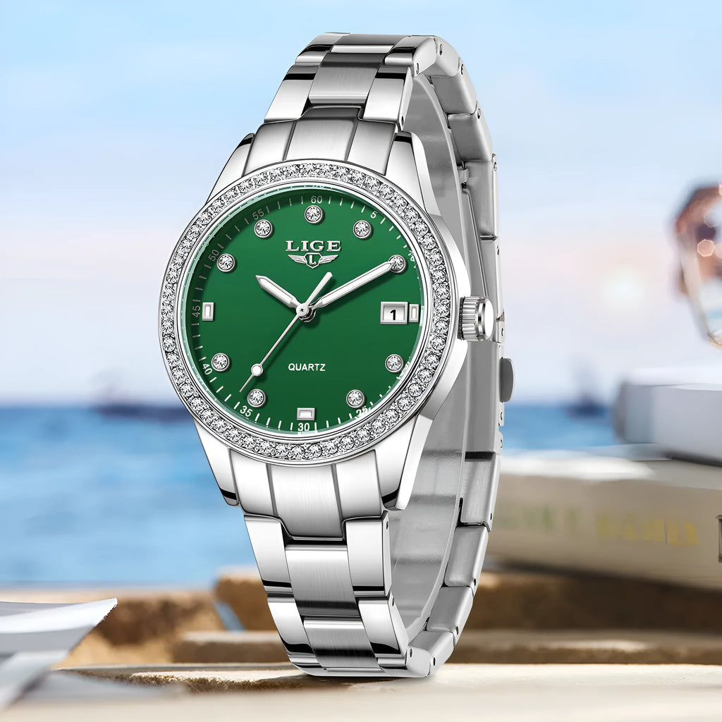 Women's silver quartz watch with diamond hour markers and luminous hands on 34mm round dial