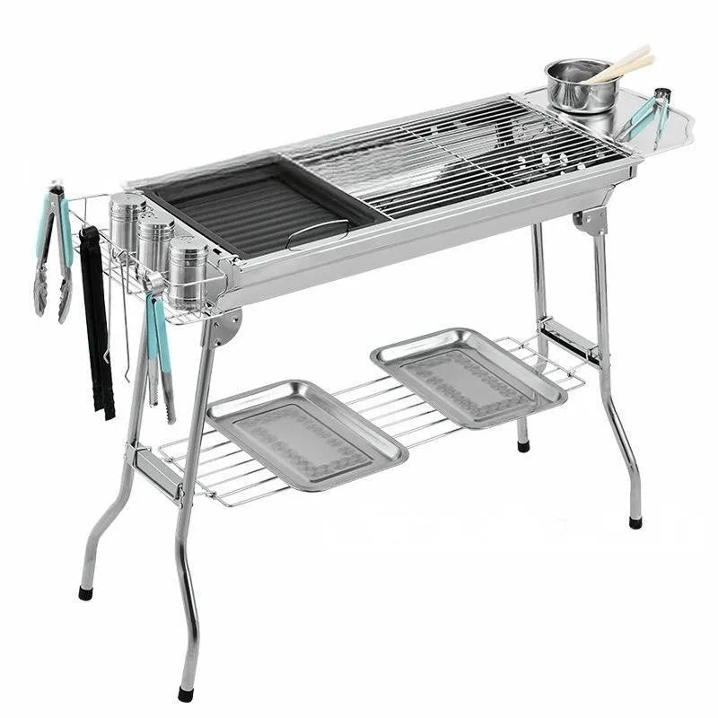Stainless steel folding barbecue oven with cooking grill, shown in natural metallic colour.