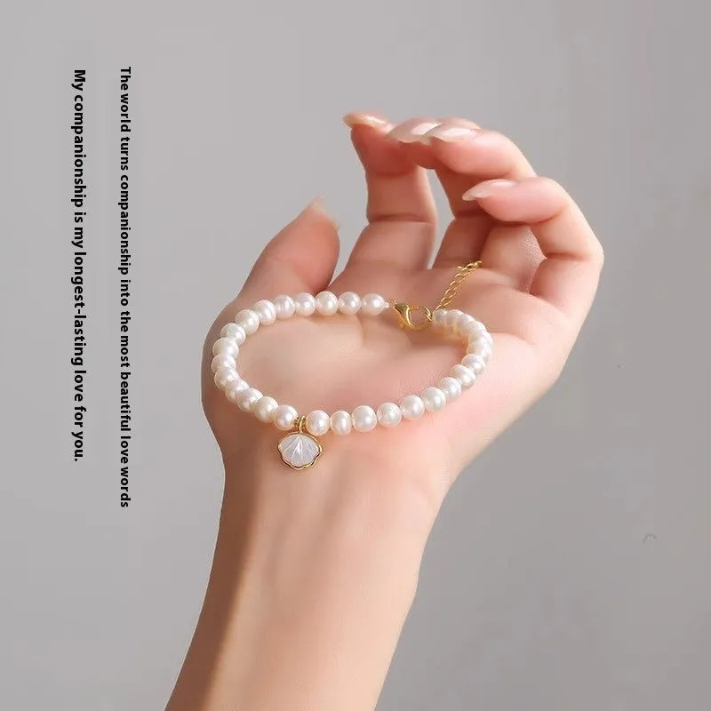 Women's freshwater pearl fan bracelet with 5-6mm pearls on elastic or chain fitting