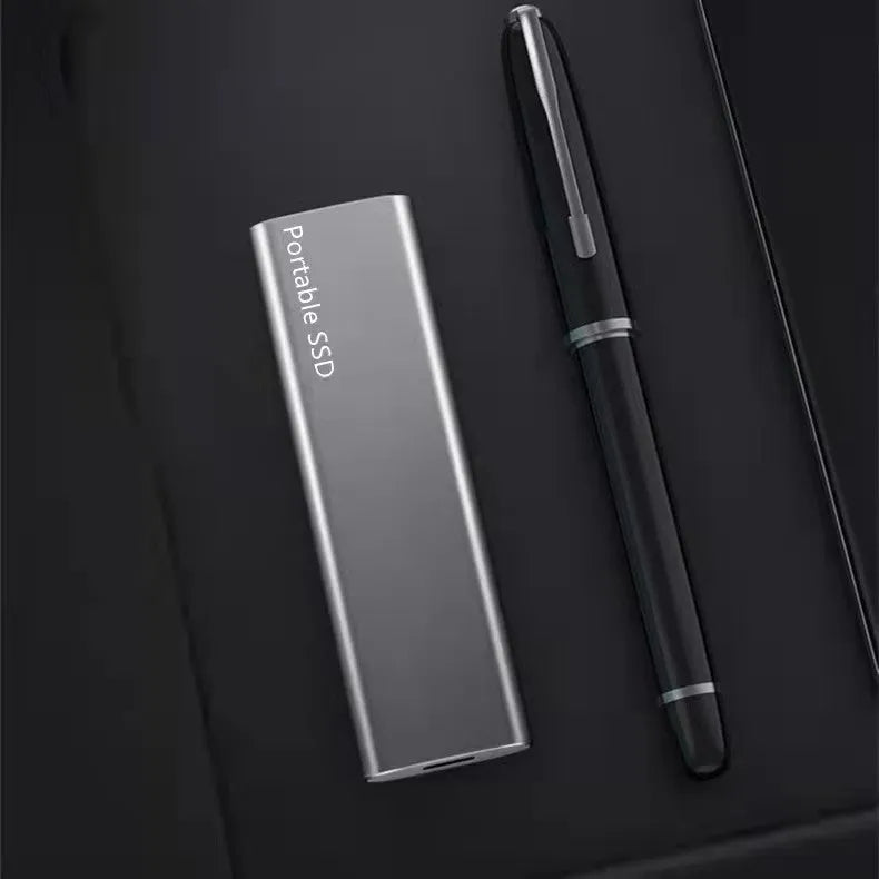 Portable external SSD with metal casing in red colour, shown alongside other colour options.