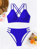 Adult women's black V-neck halter bikini with split-leg high-cut shorts.