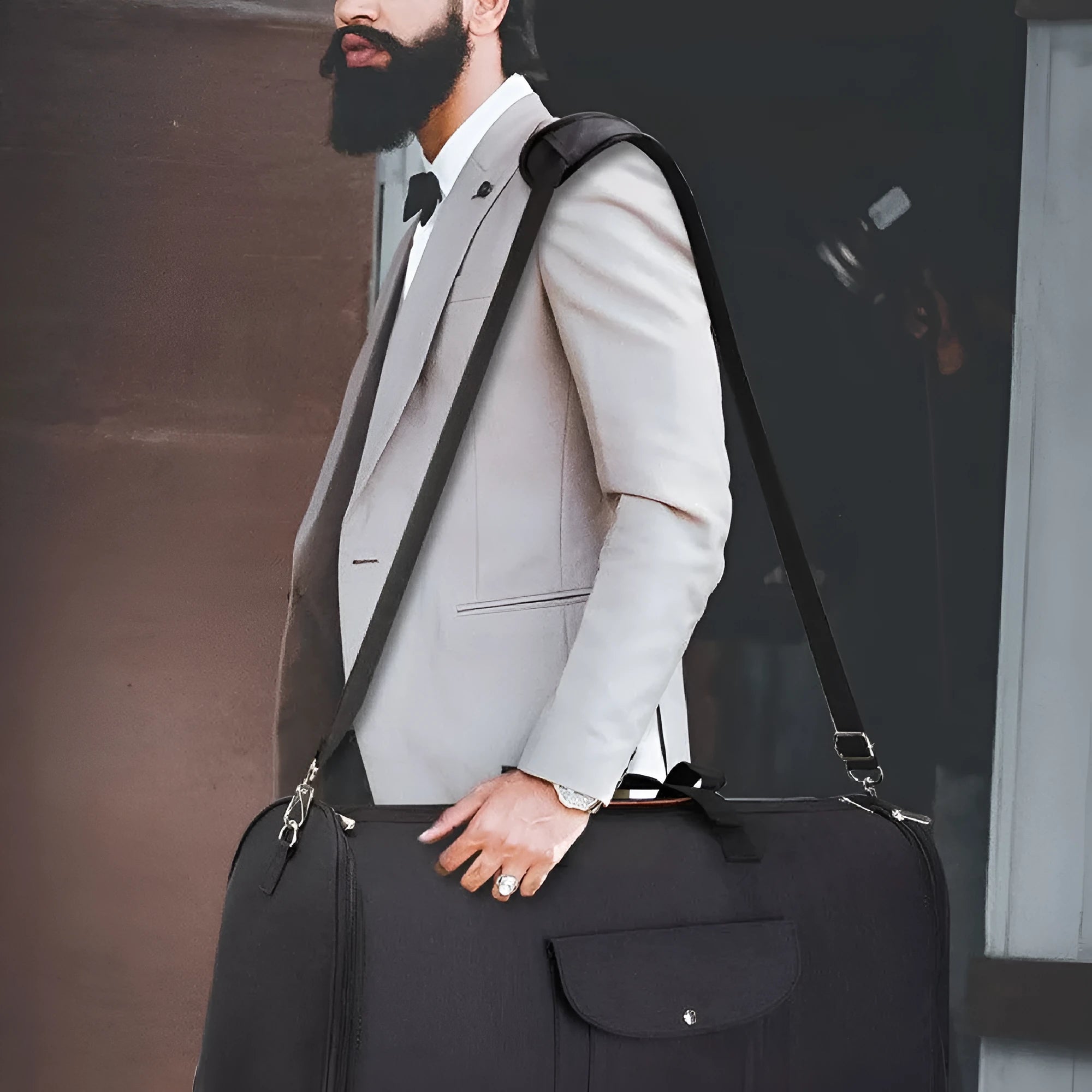 Dark blue folding duffel bag with handles, suitable for travel and gym use.