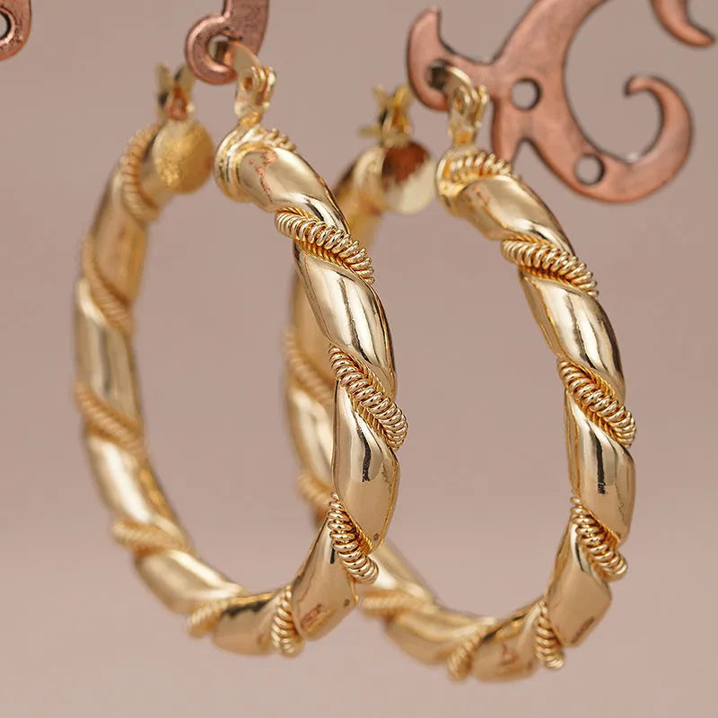 Geometric copper clip-on earrings for women with ring and line design in a golden finish.