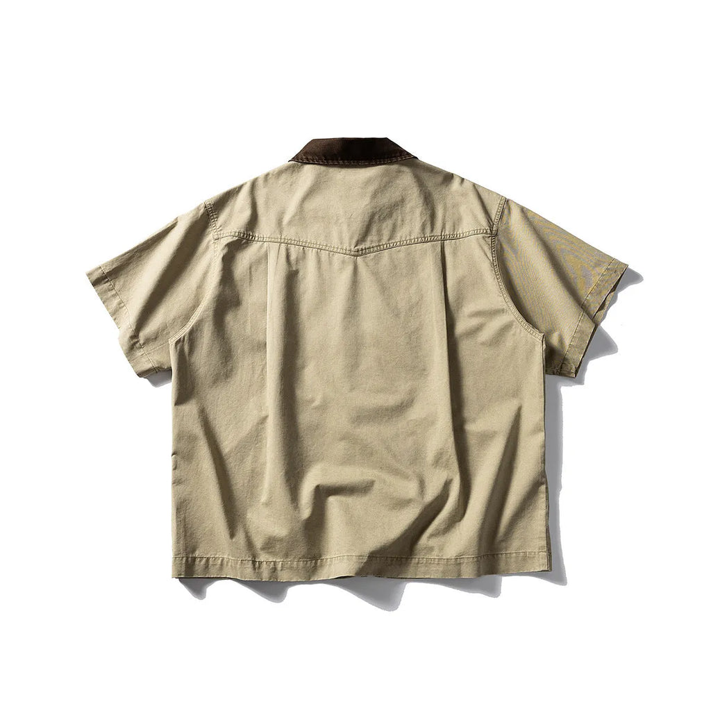 Teenager wearing a khaki loose-fit short sleeve cotton overalls shirt cardigan.