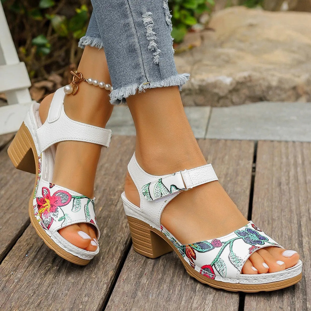 White women's casual high heel sandals with a Velcro strap buckle on a rubber sole.