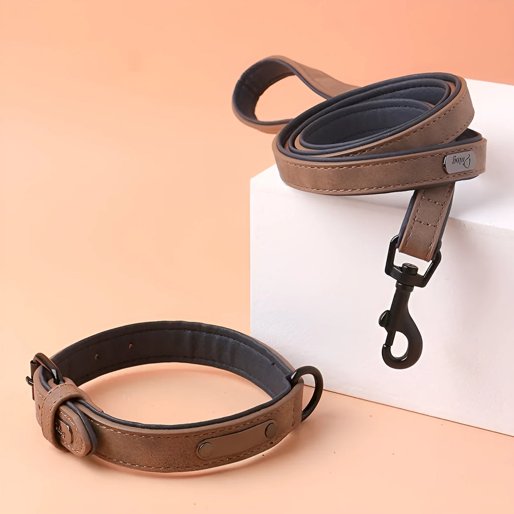 Adjustable dog collar in purple with PU leather front and microfiber fabric backing on a white background.