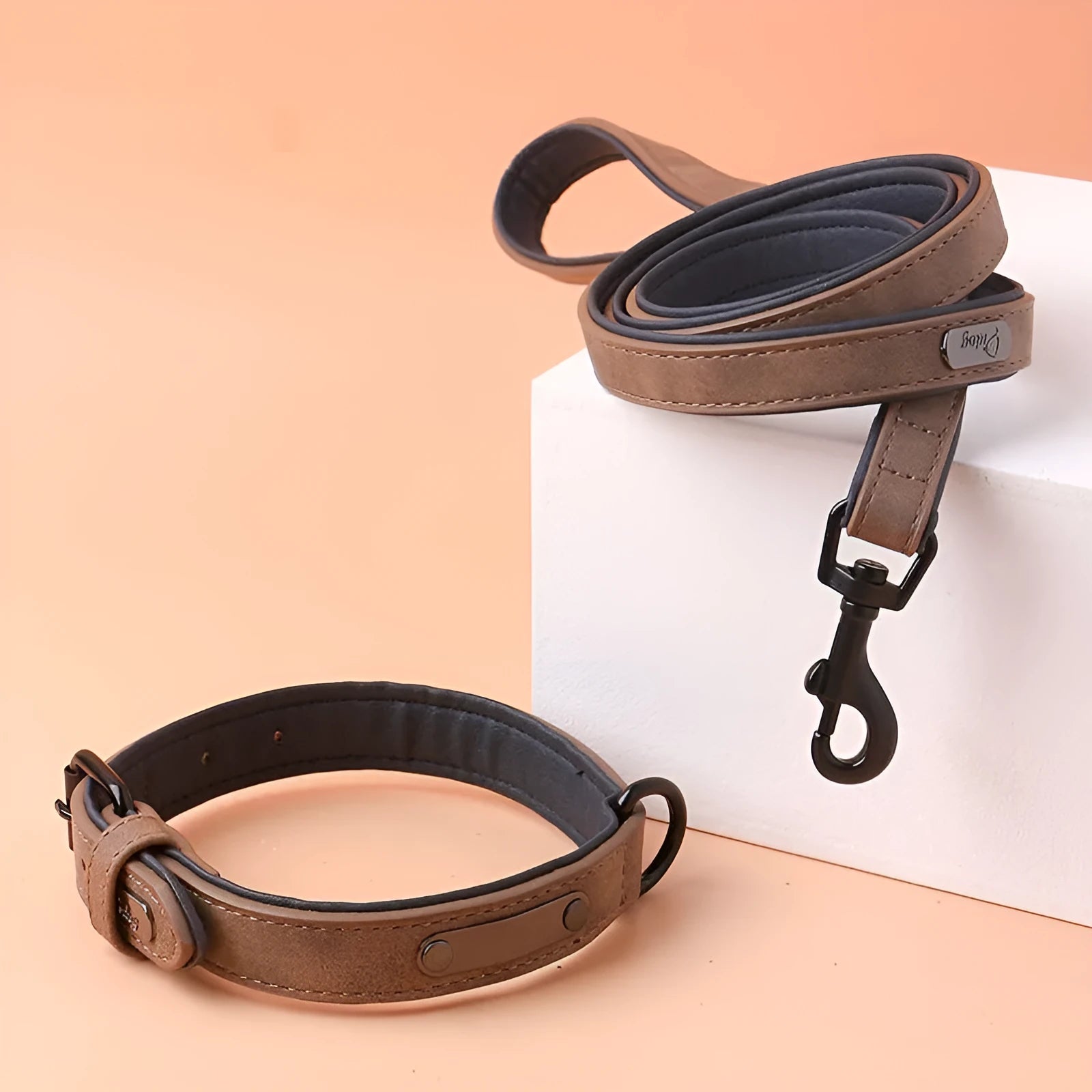 Adjustable dog collar in purple with PU leather front and microfiber fabric backing on a white background.