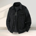 Men's slim-fit black lycra coat with ruffle detailing on a hanger.