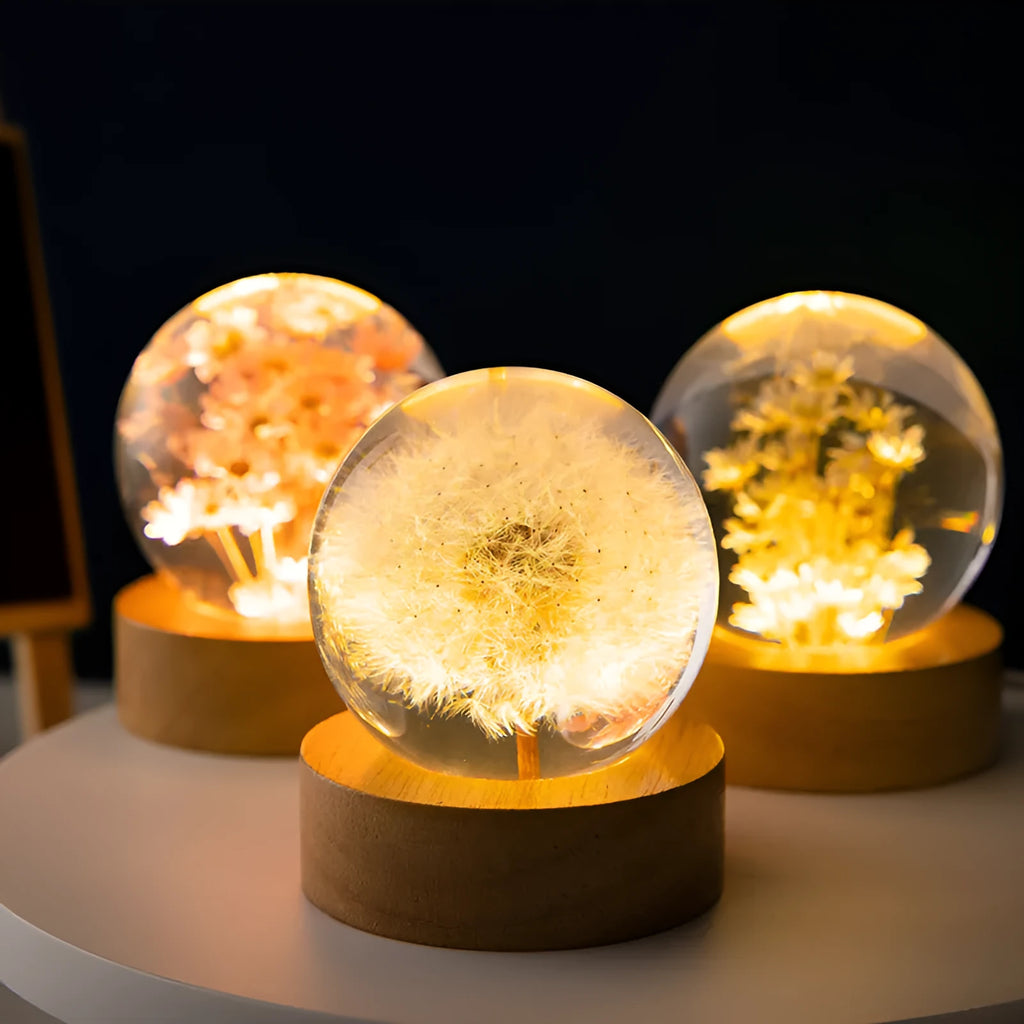 Luminous 3D dandelion crystal ball LED lamp on a beech wood stand, with USB plug.