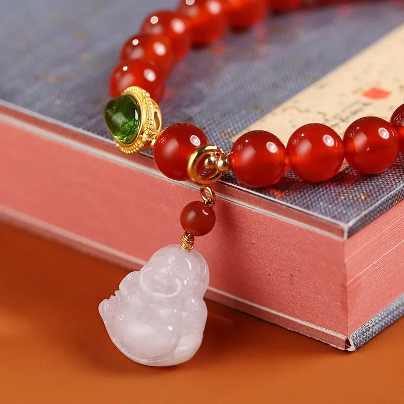 Handcrafted women's bracelet with red agate stone, amber beads, jade and Buddha pendants.