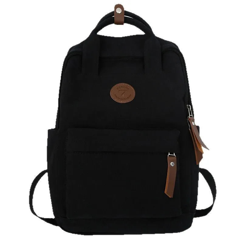 Black Oxford cloth fashion backpack with curved shoulder straps and retro sewing thread detailing