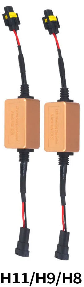 Black alloy automotive Canbus decoder for LED headlight bulbs on a white background.