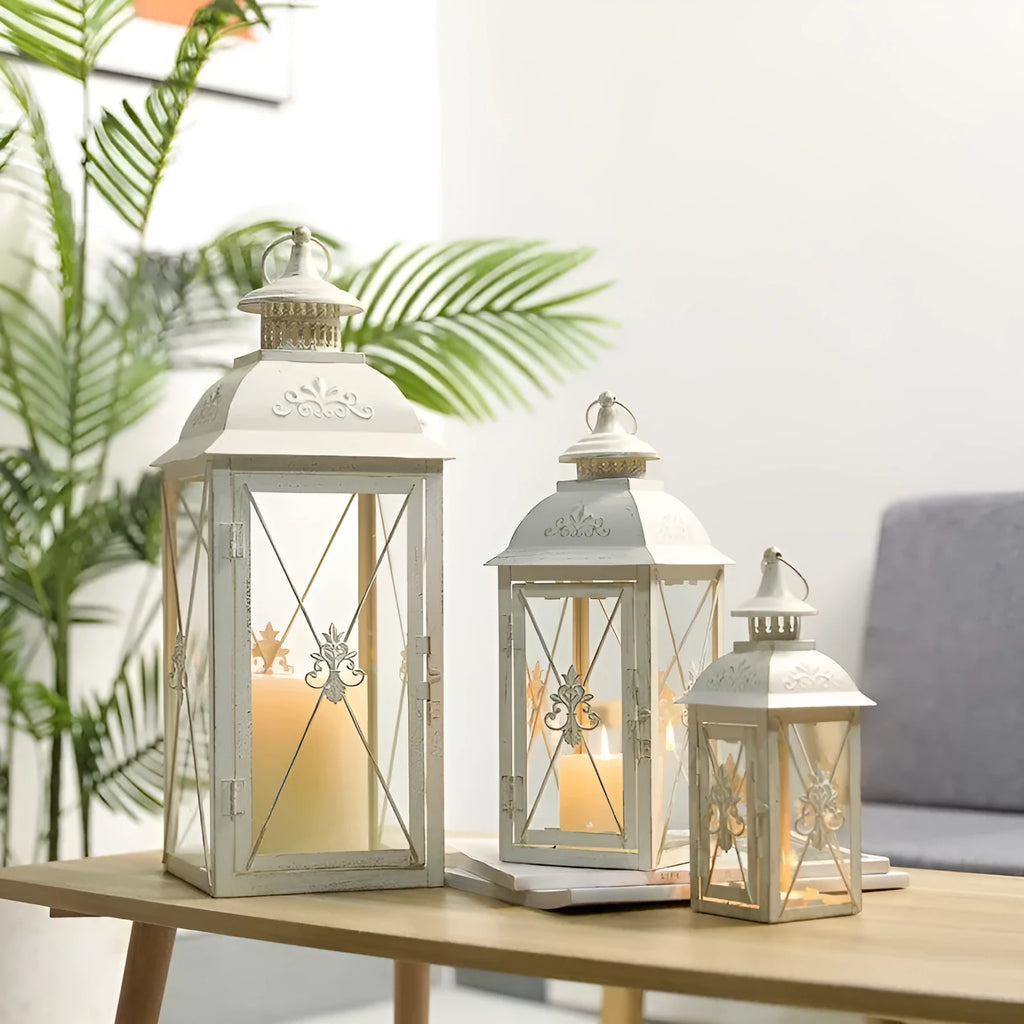 European wrought iron floor lantern with tempered glass in black gold or white gold finish, shown in small, medium, and large sizes.