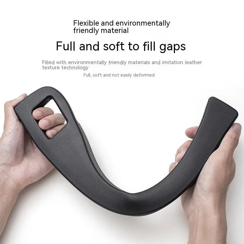 Black plastic car seat gap storage organiser box with a handle.