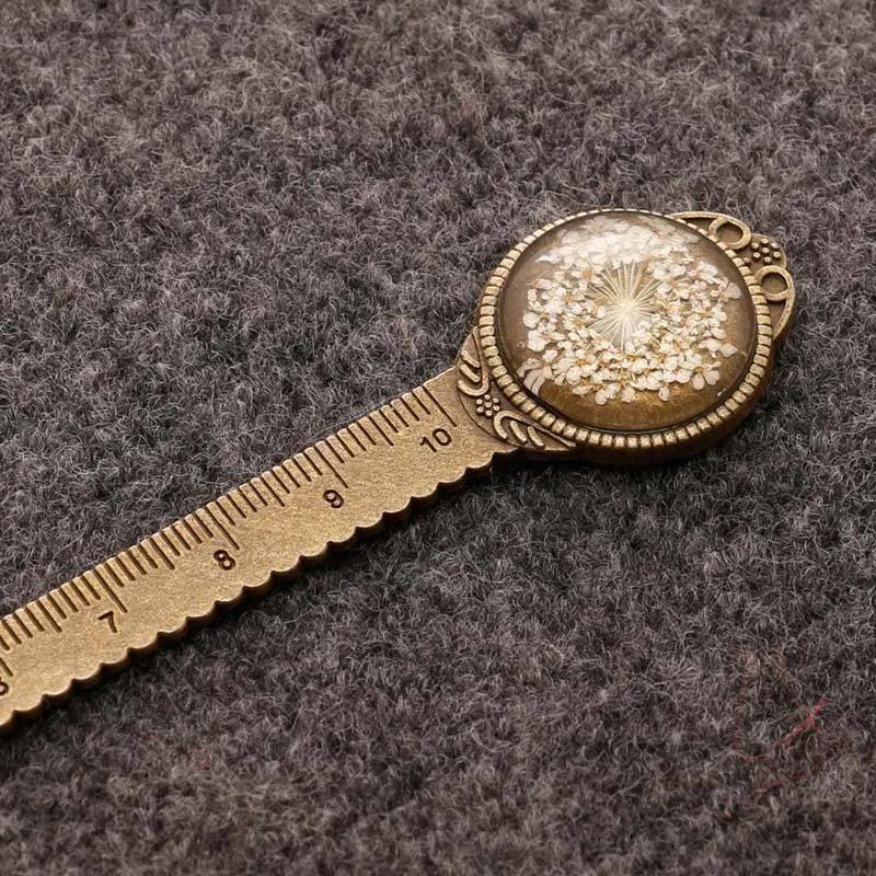 Handmade dried gypsophila flower bookmark ruler showing lace flowers, daffodils, and clovers on 12cm length