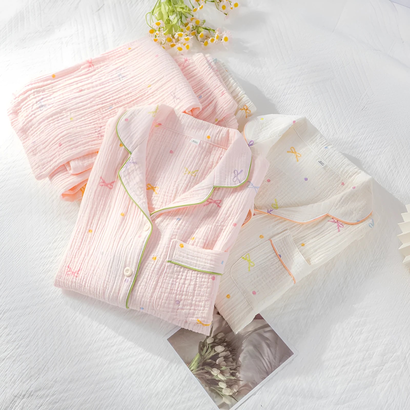 Women's long sleeve cotton pajama set in pink, featuring a top and trousers for sleepwear.