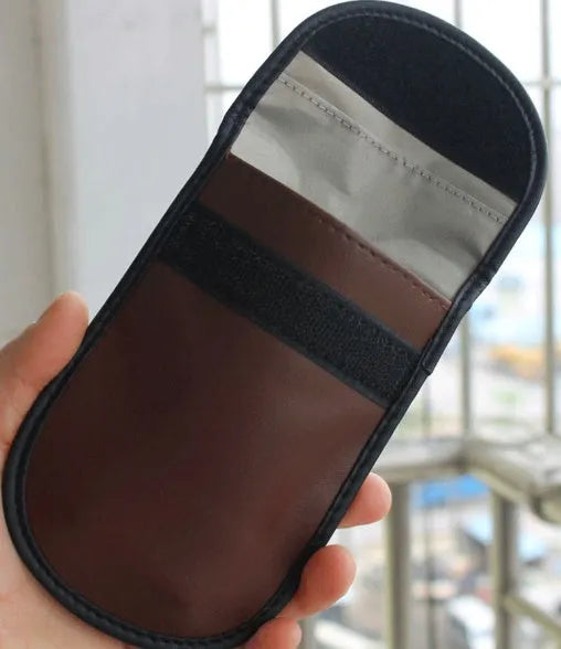 Black microfibre faraday cage bag for blocking car key, phone and RFID card signals.