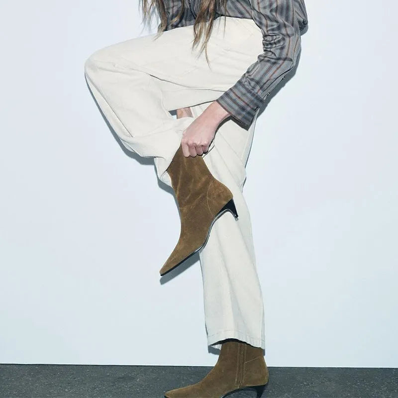 Brown square toe mid heel boots with side zip on a white background.