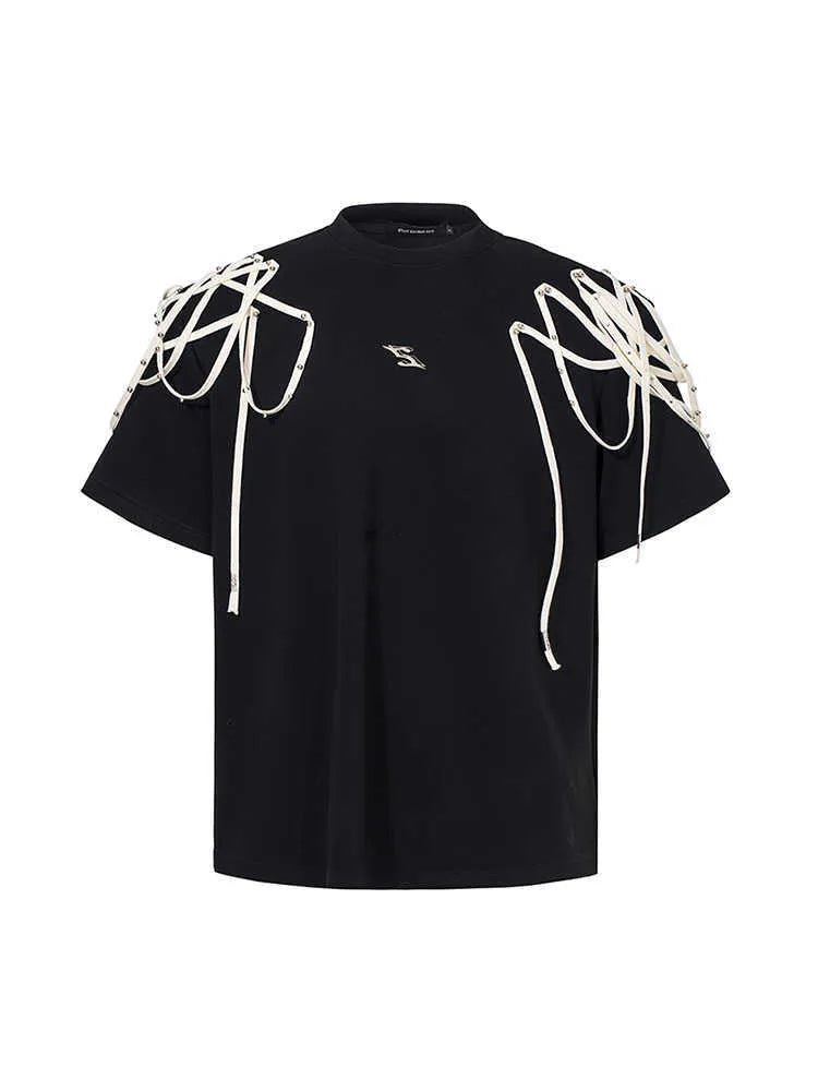 Black loose fit T-shirt with padded shoulders featuring decorative rivet detailing and ribbed texture