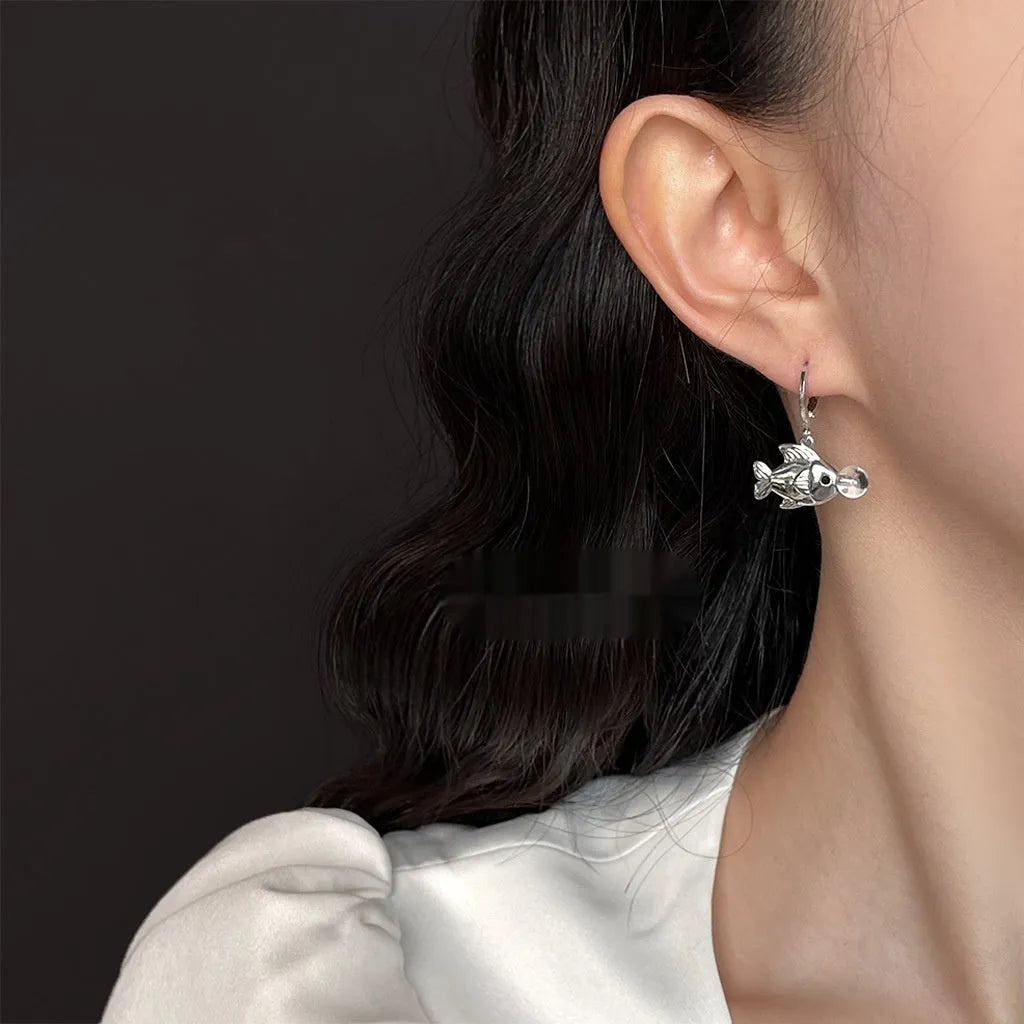 A pair of Bubble Fish design goldfish earrings made from copper with an electroplated finish.