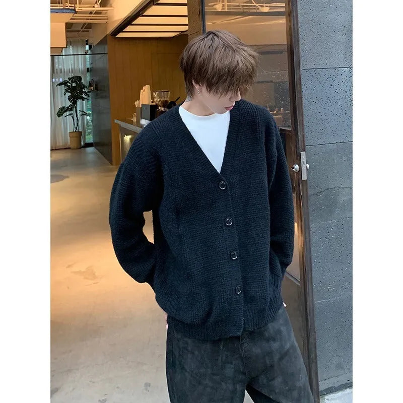 Men's loose V-neck knitted cardigan in army green, shown in a casual style