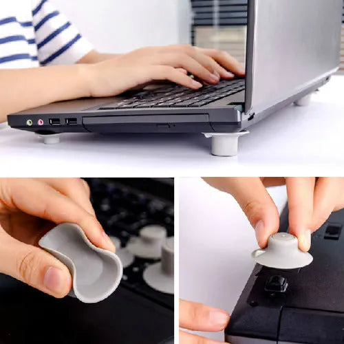 Grey plastic laptop cooling stand with four non-slip pads on a flat surface