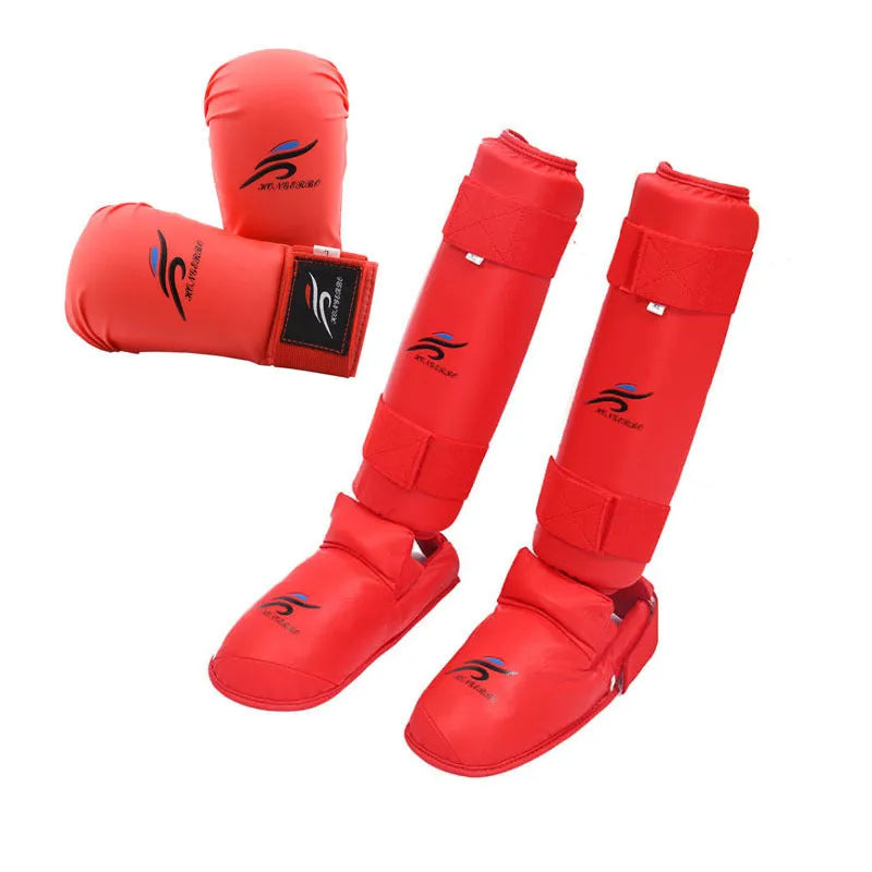 Karate protective gear set showing red helmet, boxing gloves and leg guard for martial arts training