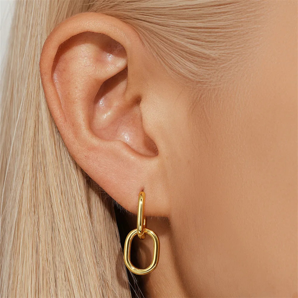 Brass diamond earclip earrings with electroplated gold finish and geometric round design