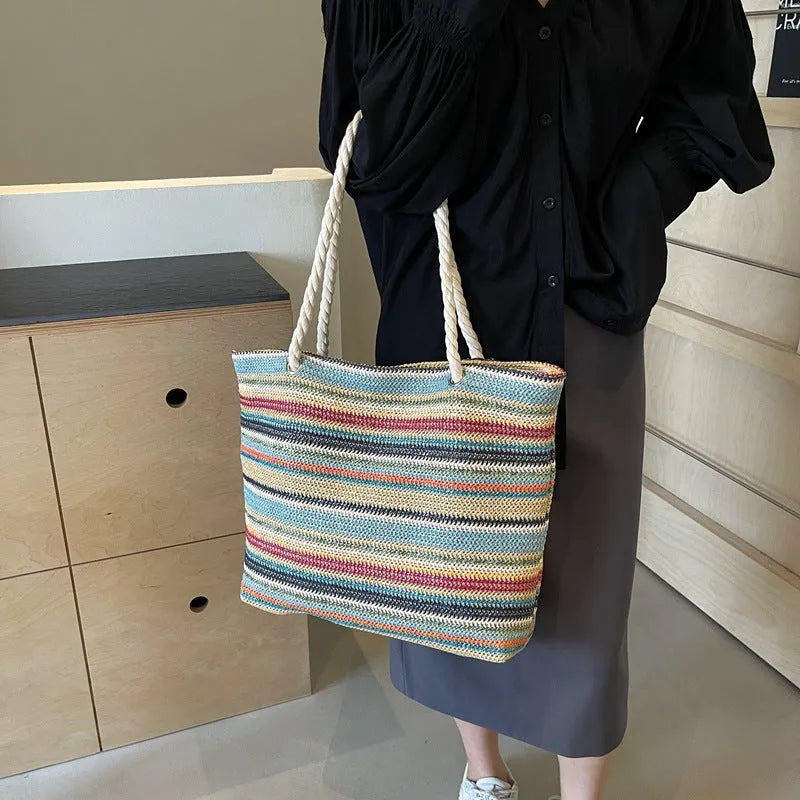 Blue woven nylon shoulder bag with large capacity and textured straw-like design