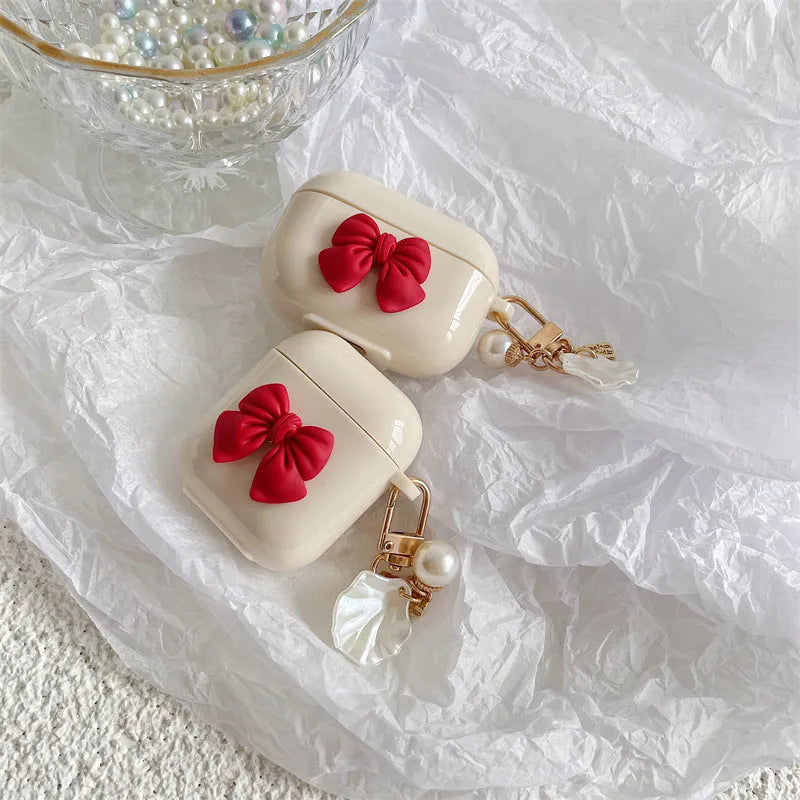 Beige red bow shell TPU AirPods case with clamshell design for AirPods Pro