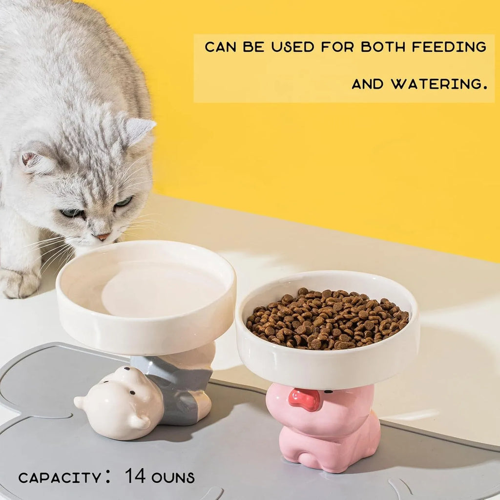 Raised ceramic cat bowl with animal theme design in pink, yellow, or white.