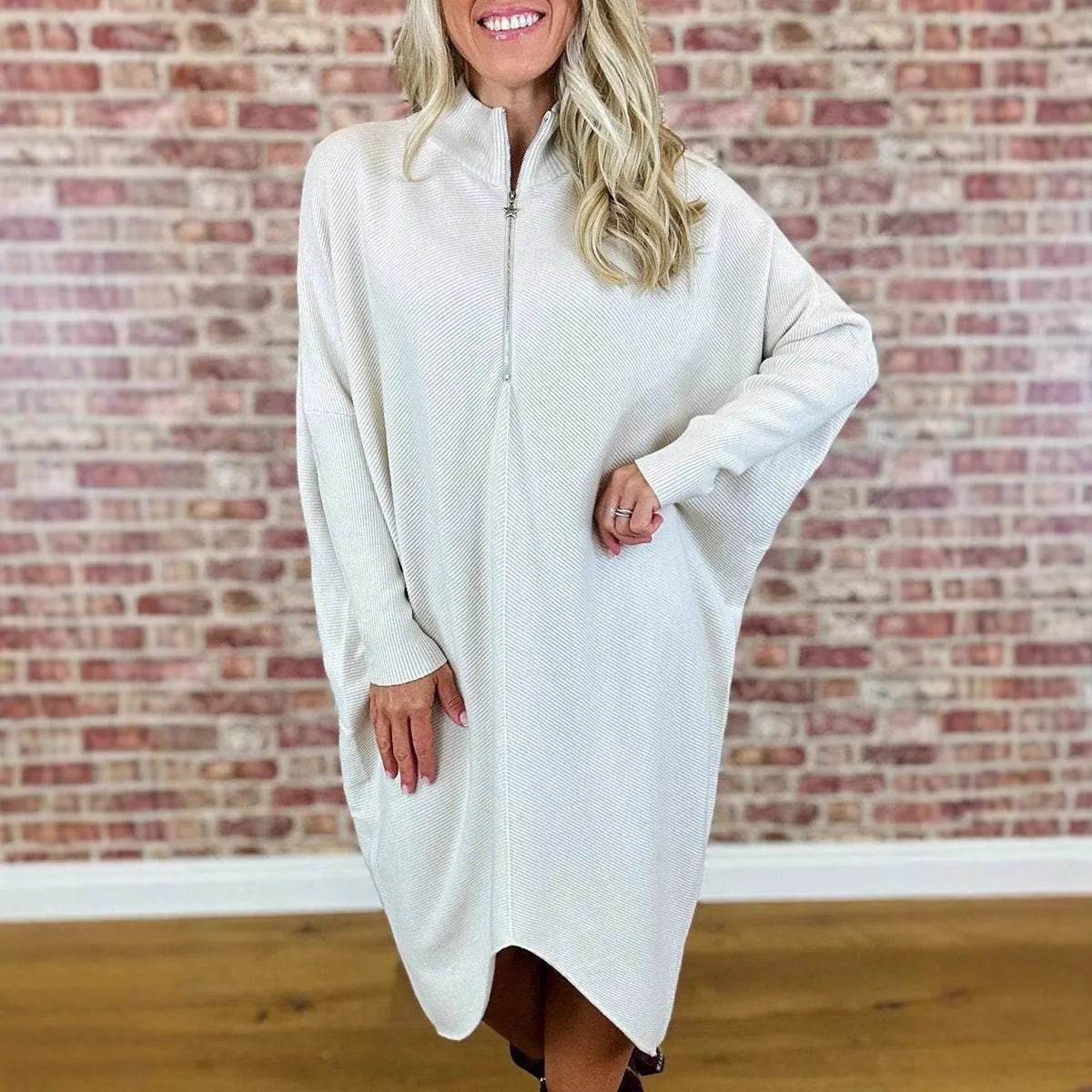 Women's solid colour loose knitted dress with raglan sleeves shown in dark green